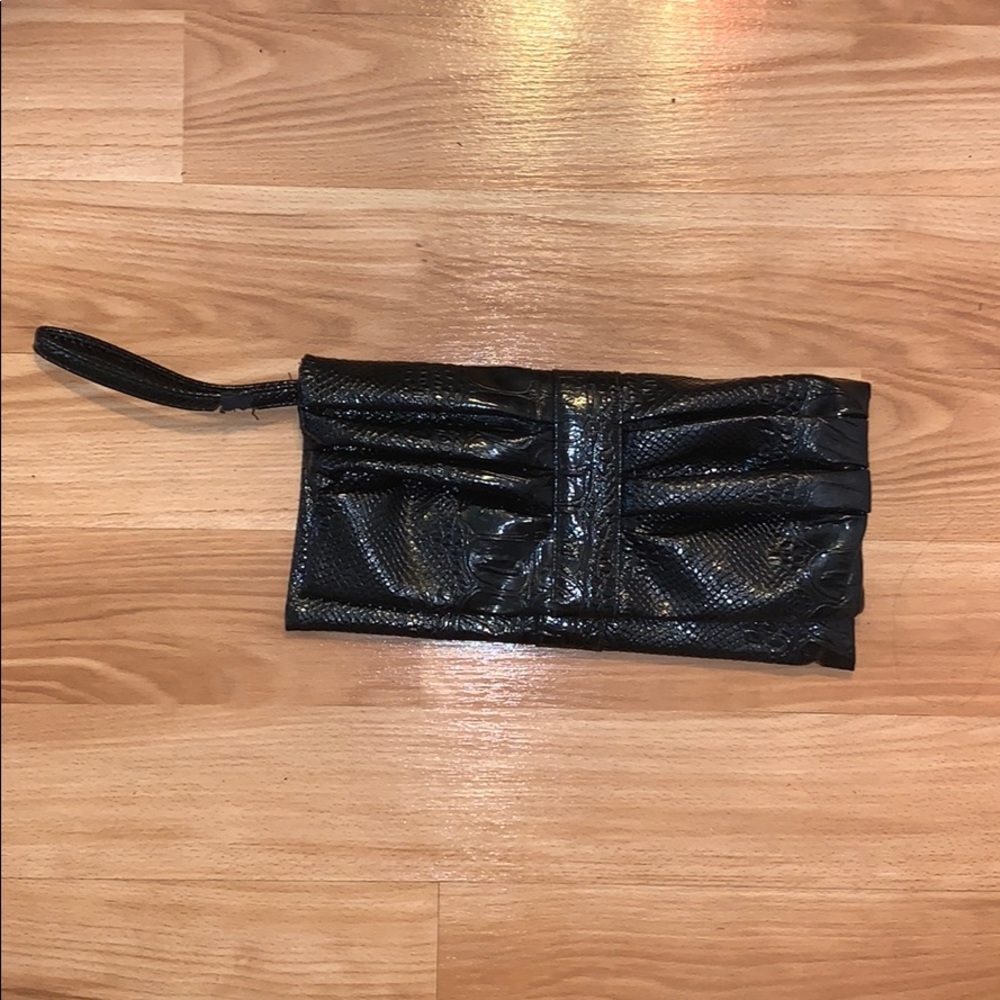 Snakeskin wrist clutch